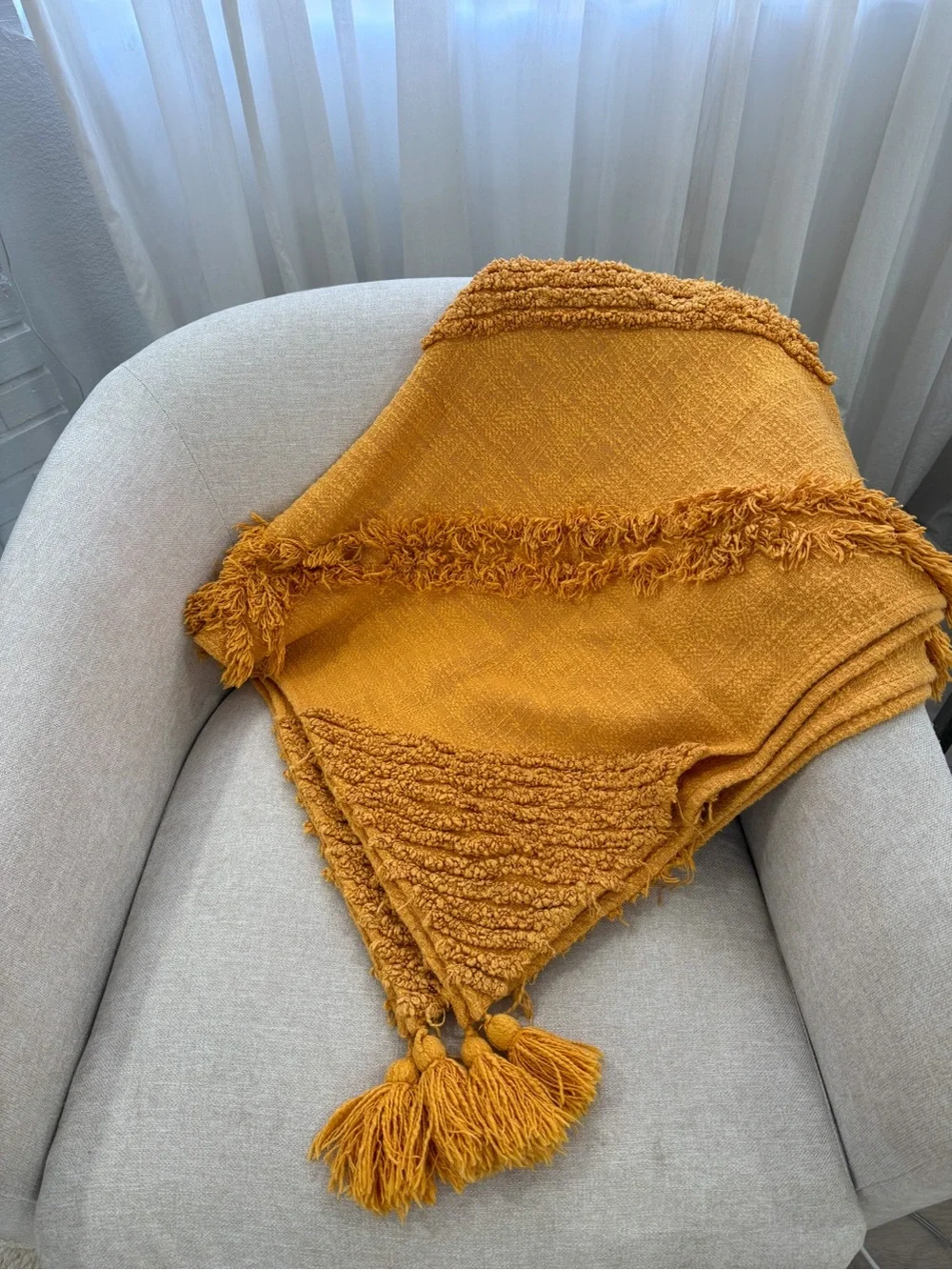 Urban Outfitters Aden Tufted Throw Blanket in Mustard
